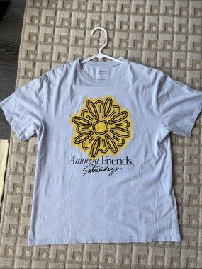 Saturdays New York City White Tee with Yellow Daisy Graphic